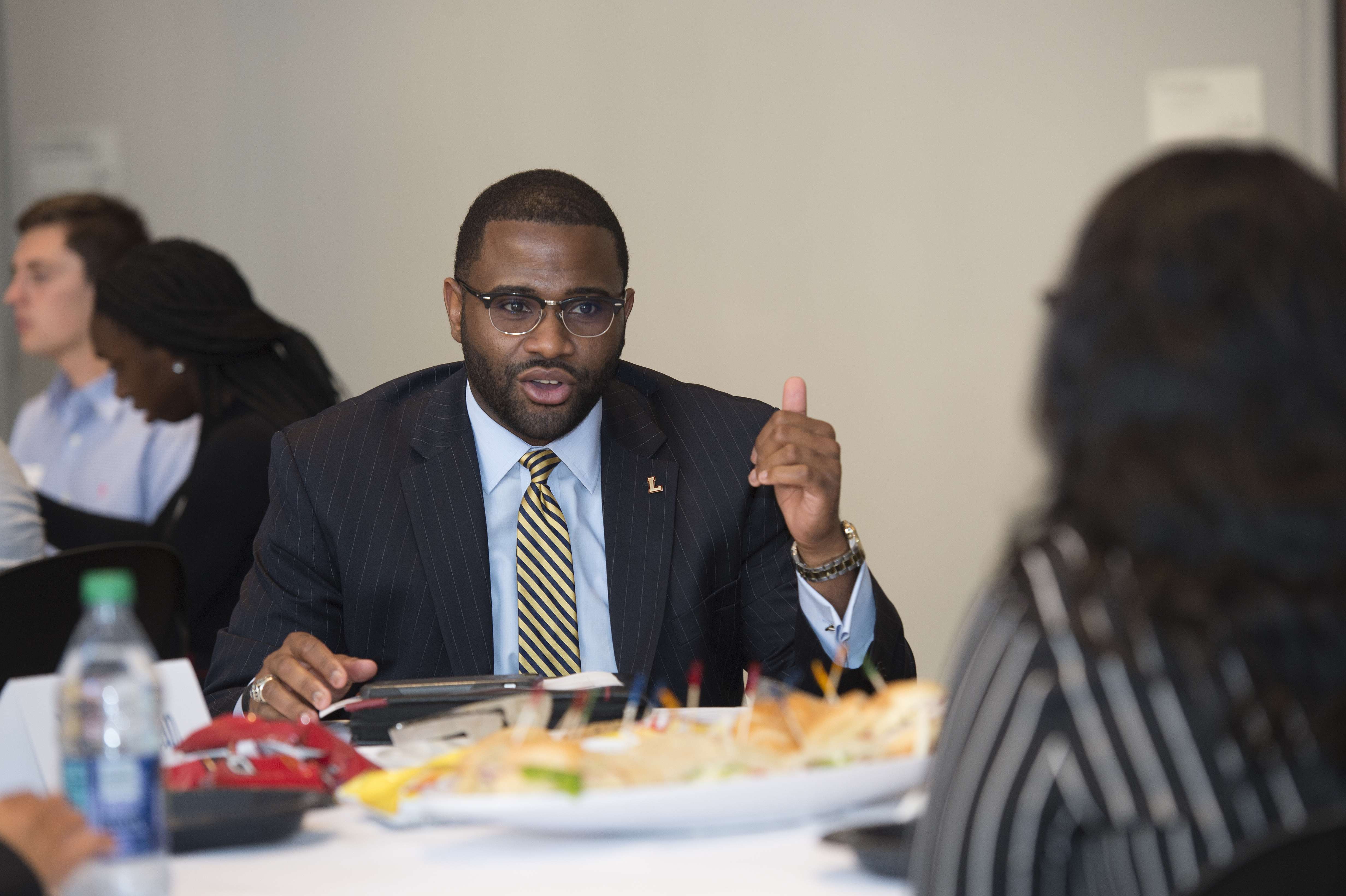 Man speaking at a table