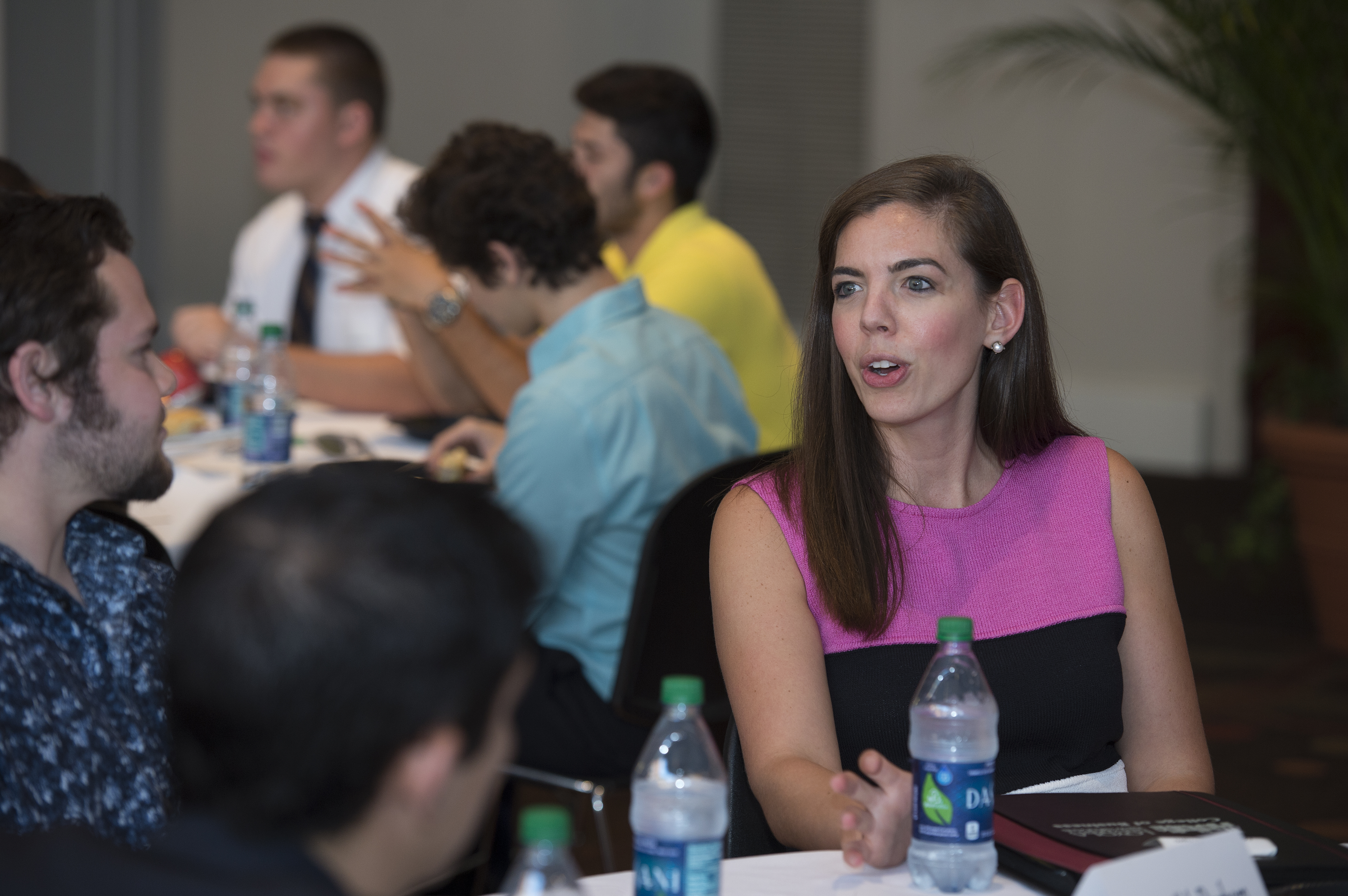 Woman discussing entrepreneurship with her colleagues