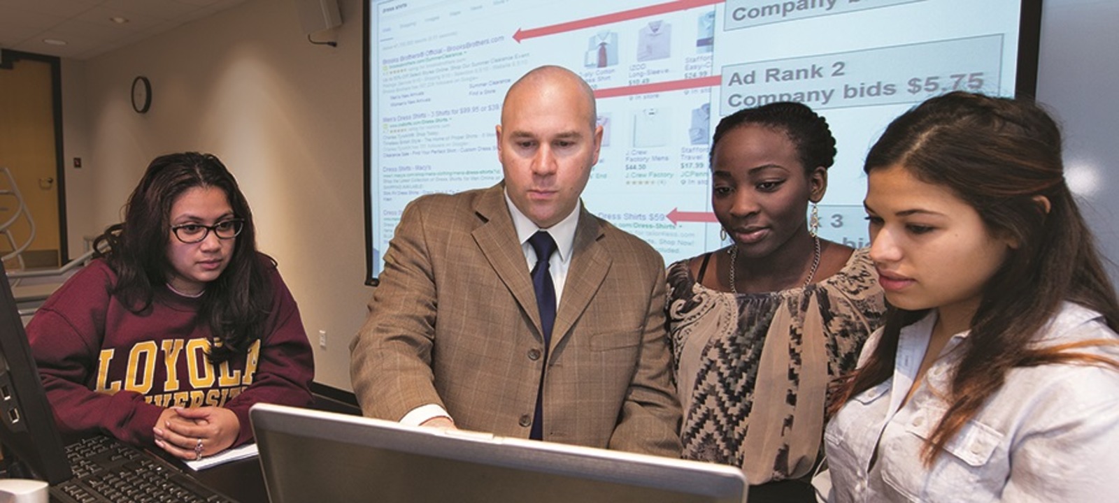 A professor in the midst of advising his students