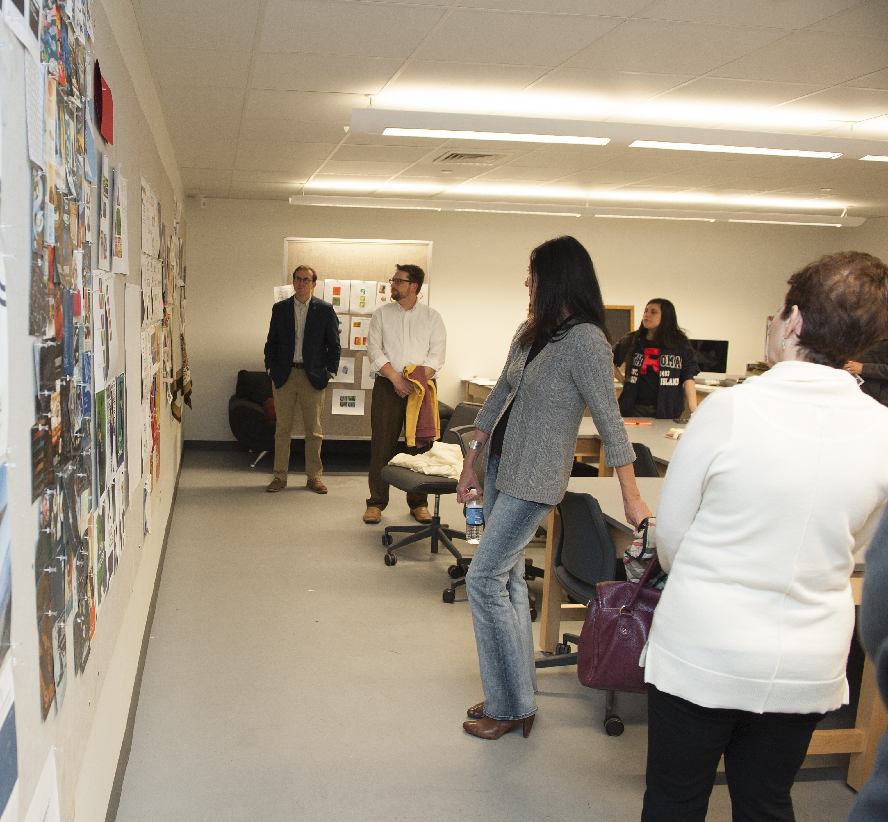 A group of students reviewing their submisisons